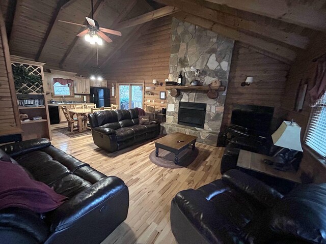 bedroom featuring a closet, light hardwood / wood-style flooring, and wood walls