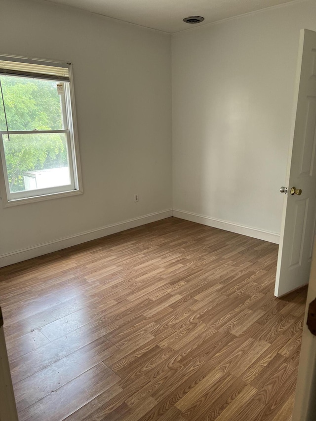 unfurnished room featuring light hardwood / wood-style floors