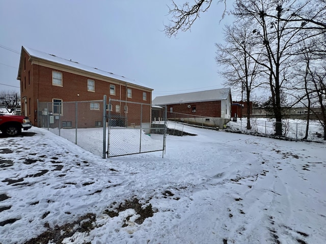 240 E Main St, Mount Vernon, KY 40456 - snow covered house with brick siding and fence