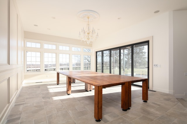 unfurnished dining area with a chandelier