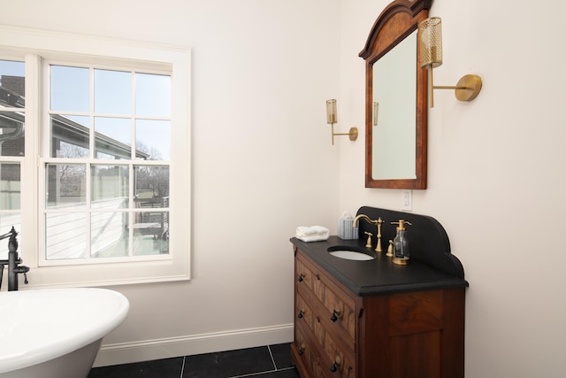 bathroom featuring tile patterned flooring and vanity