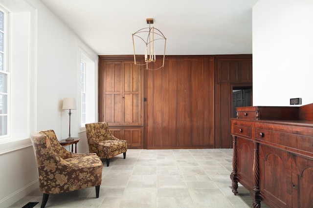 living area featuring a notable chandelier