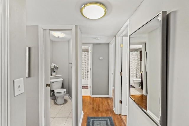 bathroom with tile patterned floors and toilet