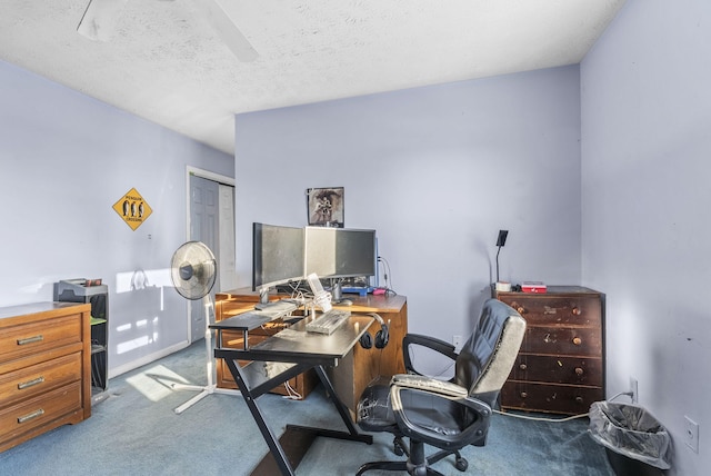 carpeted office with a textured ceiling