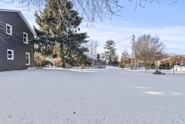 view of yard layered in snow