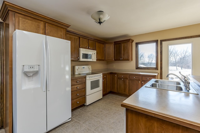 kitchen with sink and white appliances