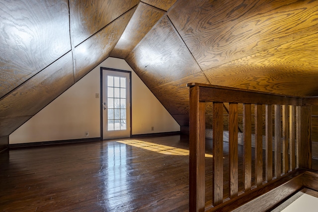 bonus room featuring vaulted ceiling and hardwood / wood-style floors