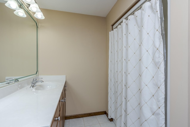 bathroom featuring tile patterned flooring and vanity