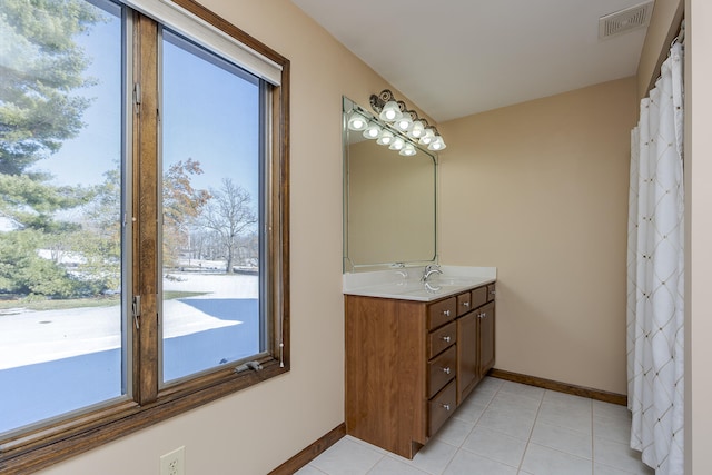 bathroom featuring vanity and tile patterned flooring