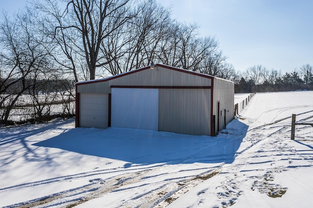 view of snow covered garage