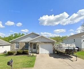 view of front of house with a front lawn and a garage