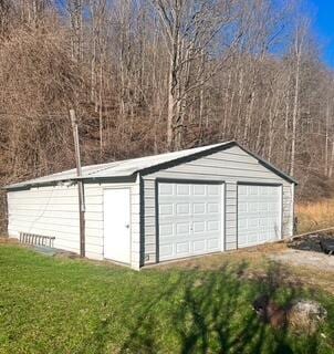 garage featuring a yard