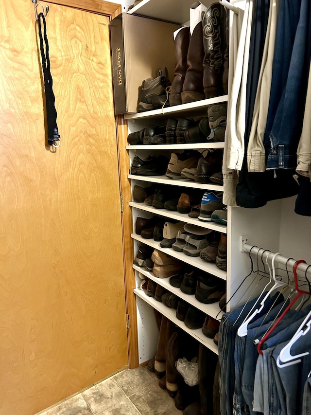 walk in closet with tile patterned floors