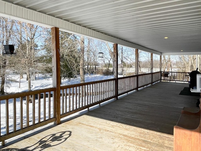 view of snow covered deck