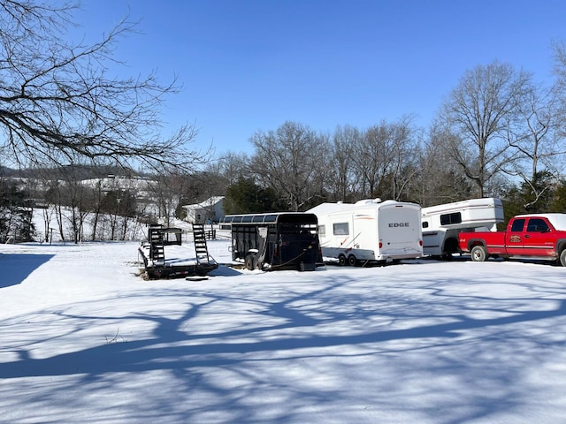 view of snow covered parking