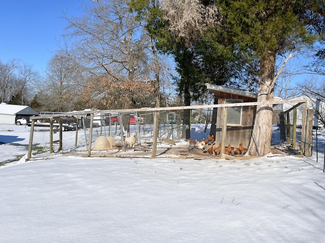 view of yard layered in snow