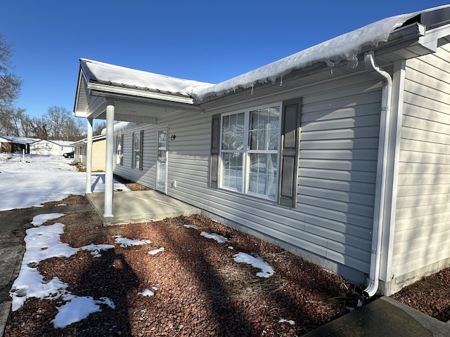 view of snow covered property