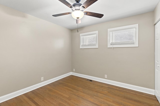 unfurnished room featuring hardwood / wood-style flooring and ceiling fan