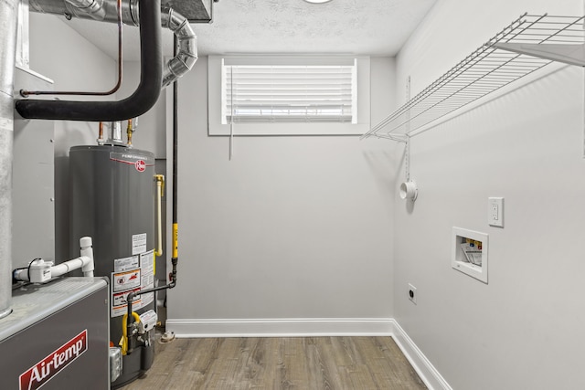 utility room with water heater