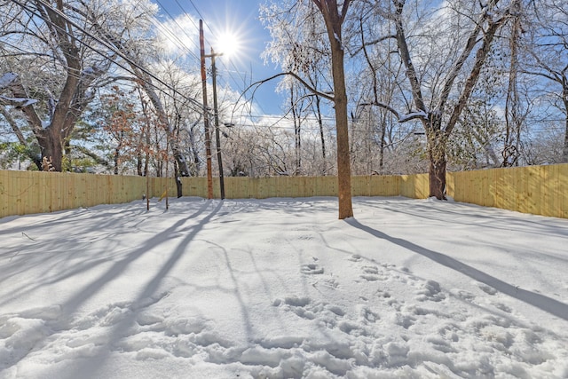 view of yard covered in snow