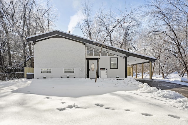 view of snow covered house