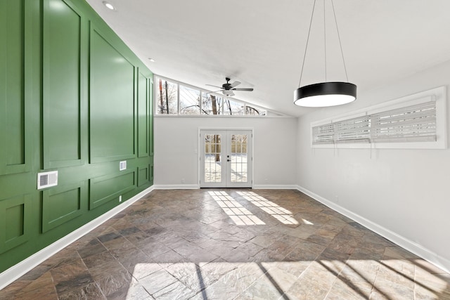 spare room featuring french doors, vaulted ceiling, and ceiling fan