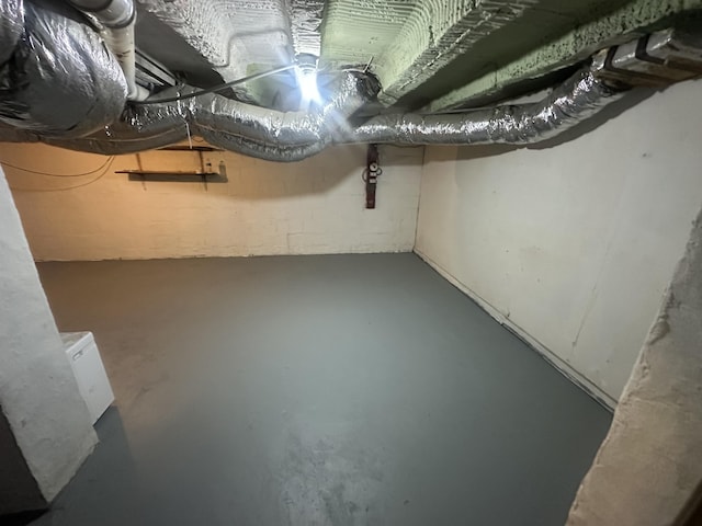 below grade area with concrete block wall