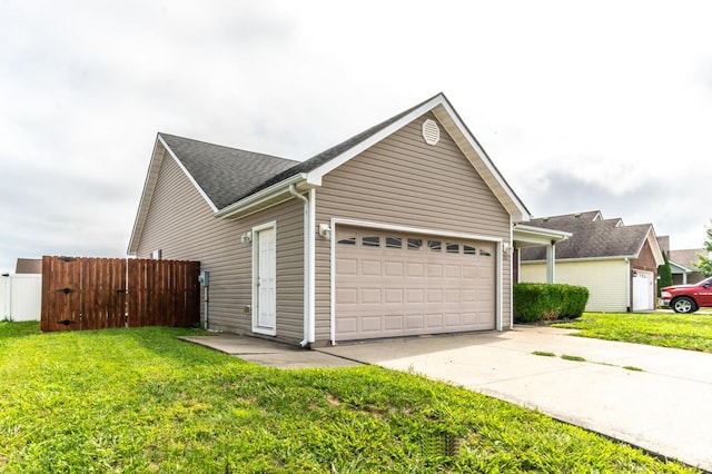 view of front facade with a front yard and a garage