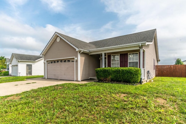 ranch-style home featuring a garage and a front lawn