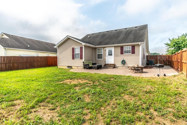 back of house with a yard, a patio, central AC unit, and an outdoor fire pit