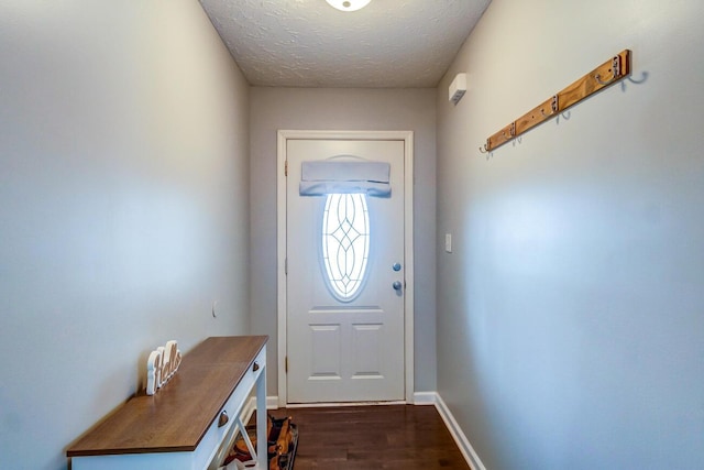 doorway featuring dark wood-type flooring