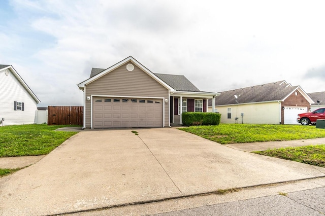 view of front of house with a garage and a front lawn