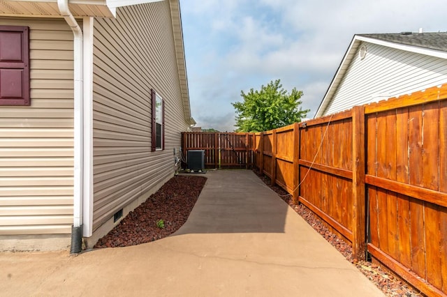 view of home's exterior with a patio and central AC