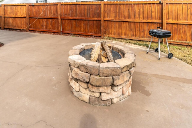 view of patio / terrace with a fire pit