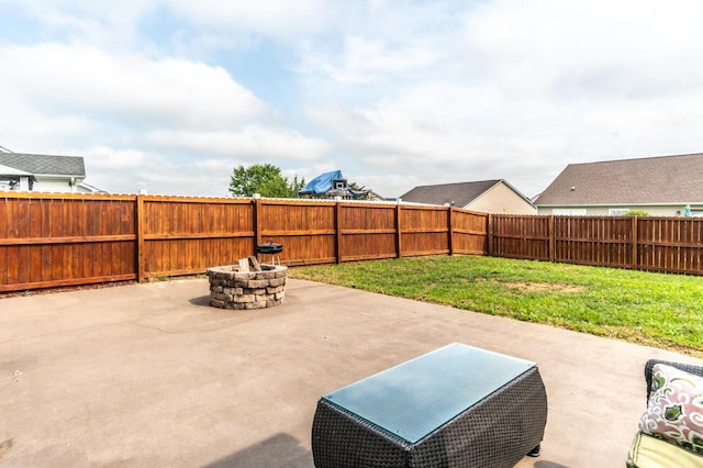 view of patio with a fire pit