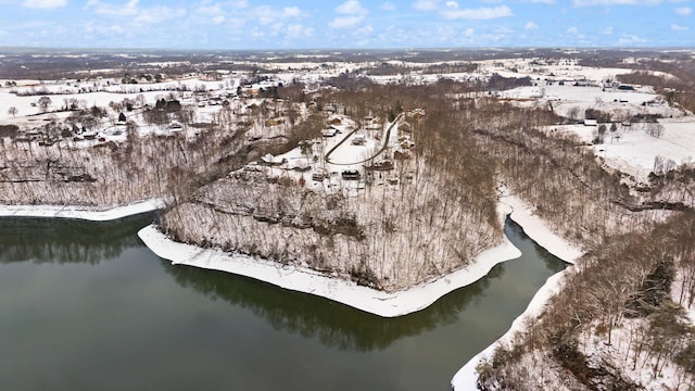 snowy aerial view featuring a water view