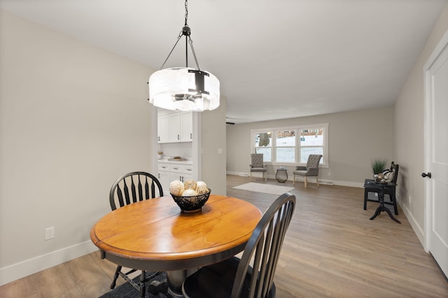 dining room featuring light wood-type flooring