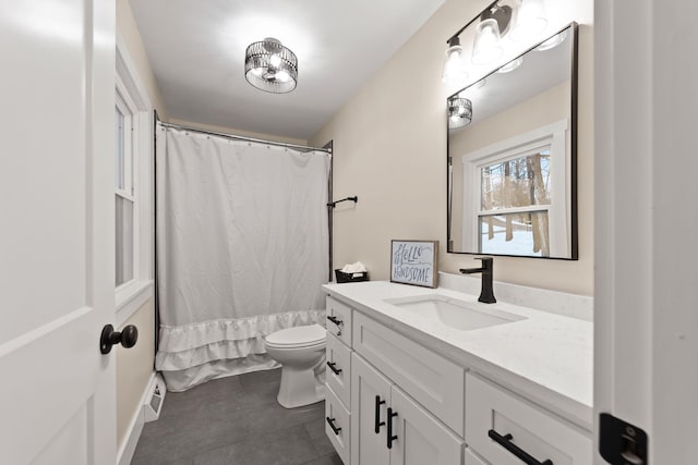 full bathroom with vanity, toilet, and shower / bath combo