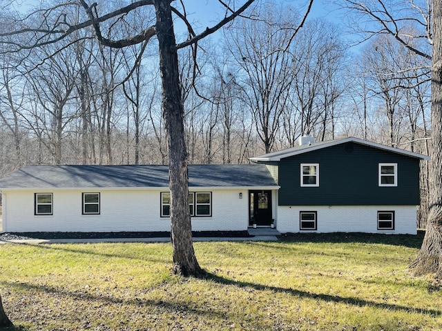 split level home featuring a front lawn