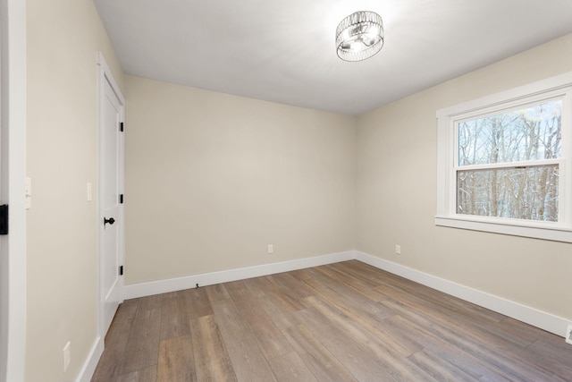 spare room with hardwood / wood-style flooring