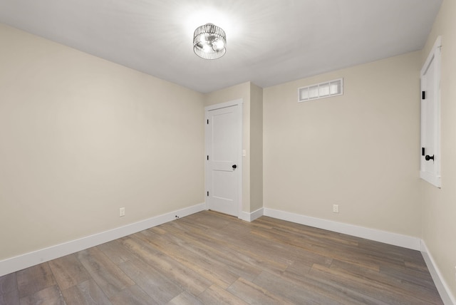 empty room featuring wood-type flooring