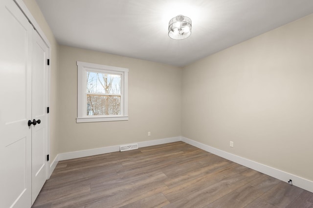 spare room with light wood-type flooring