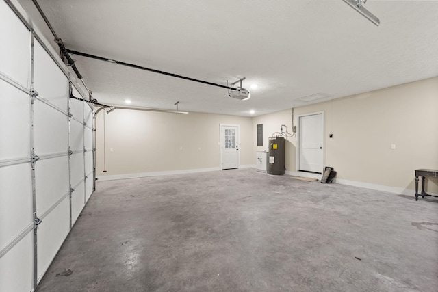 garage with a garage door opener and water heater