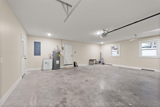 garage with a garage door opener and electric water heater