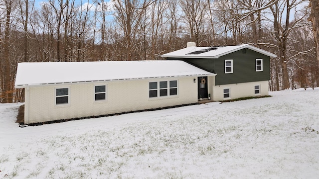 view of snow covered property