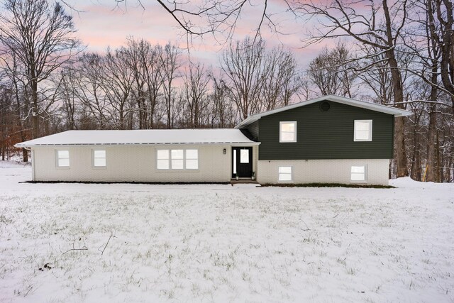 view of snow covered house