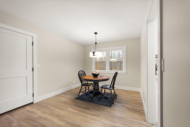 dining room with light wood-type flooring