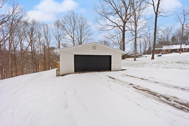 view of snow covered garage