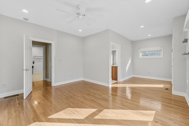 unfurnished living room with ceiling fan and light hardwood / wood-style flooring