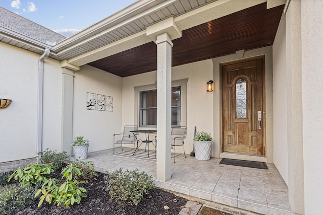 doorway to property featuring covered porch